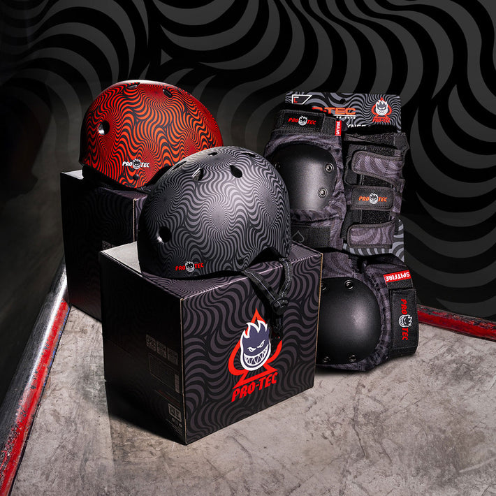 Pro-Tec x Spitfire skateboarding protective gear including helmets and knee pads on a dark background.